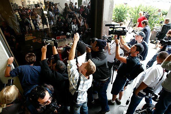 Media cover the arrival of Lindsay Lohan at the Beverly Hills Courthouse.