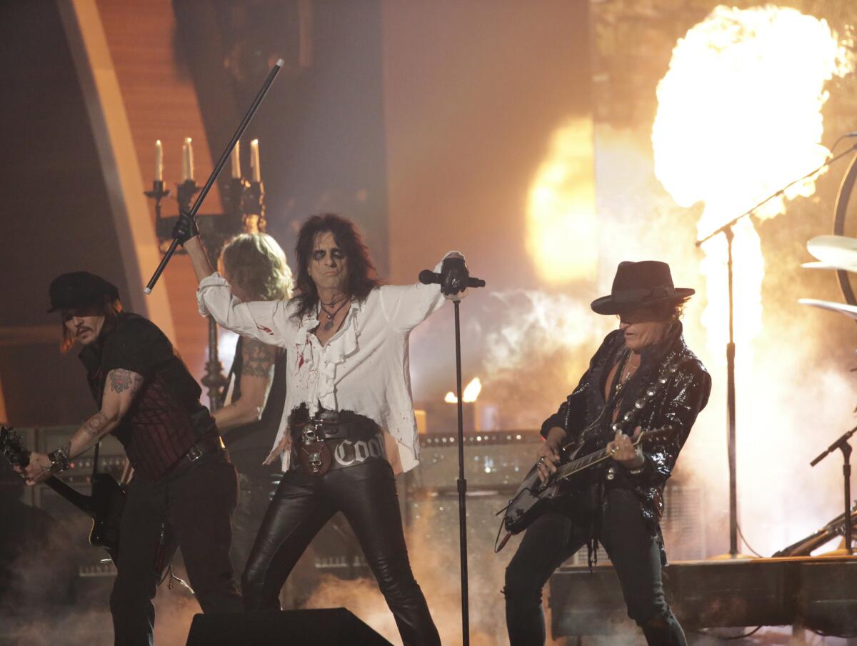 Joe Perry, right, performs with the Hollywood Vampires on Monday night during the 58th Grammy Awards.