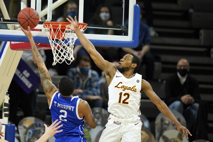 Drake forward Tremell Murphy (2) drives to the basket ahead of Loyola of Chicago guard Marquise Kennedy (12) during the first half of an NCAA college basketball game, Sunday, Feb. 14, 2021, in Des Moines, Iowa. (AP Photo/Charlie Neibergall)