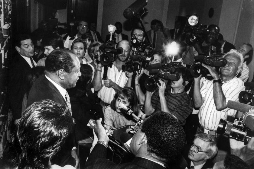 April 5, 1991: Los Angeles Mayor Tom Bradley is confronted by the media after leaving city hall chambers prior to closed session regarding police chief Daryl Gates during furor over Rodney King beating.