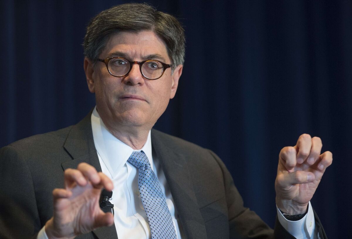 Treasury Secretary Jacob Lew says a trend of U.S. companies reorganizing as foreign firms serves "to hollow out the U.S. corporate income tax base." Above, Lew at a forum this month in Washington.