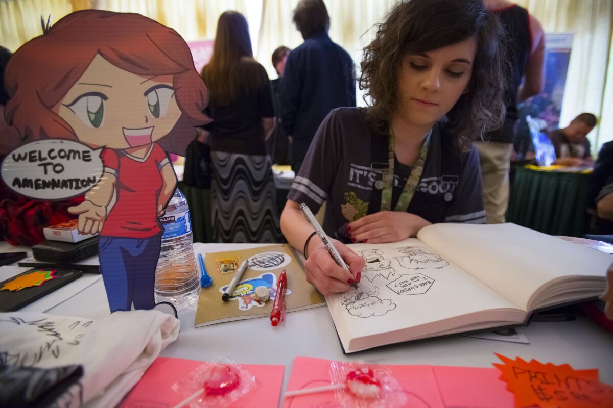 Comic Fest attendee works on sketches.