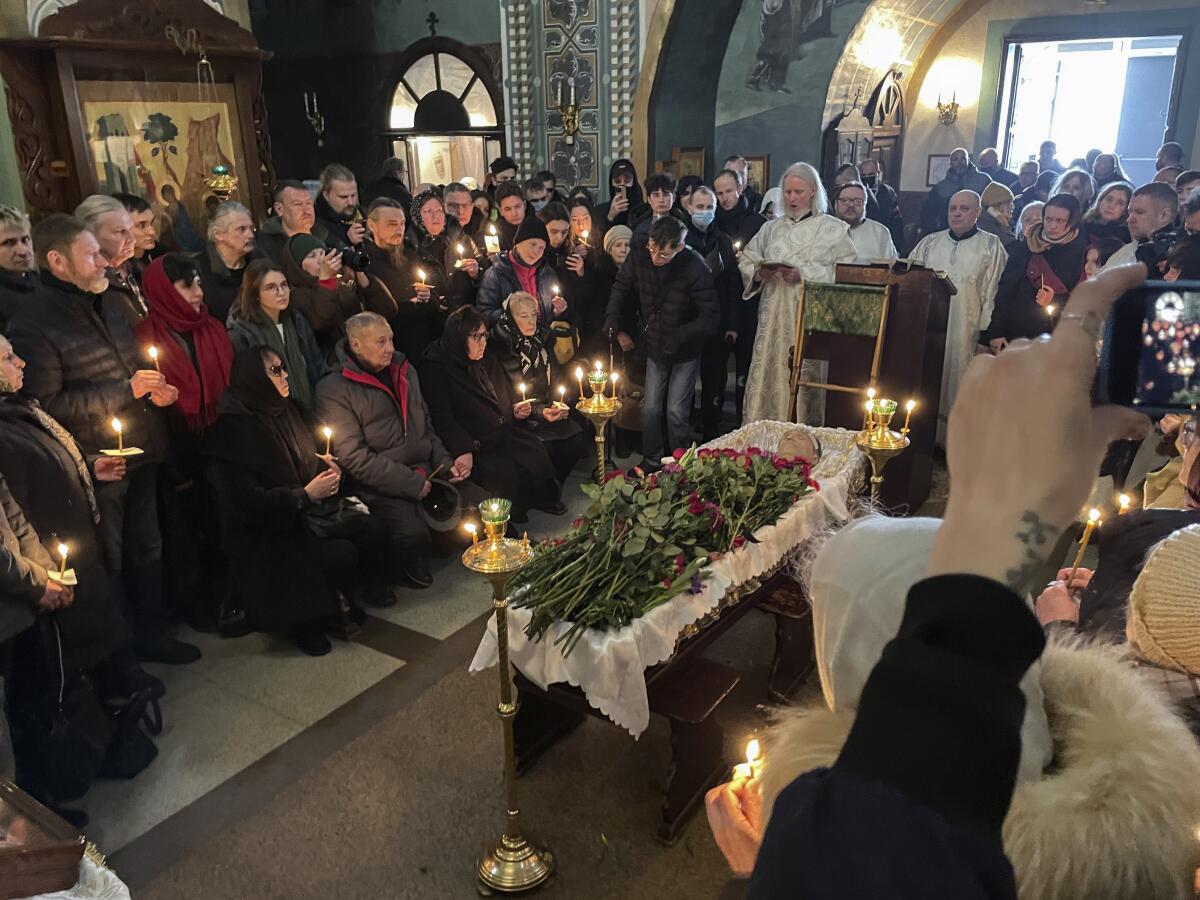 Relatives and friends pay  respects at the coffin of Russian opposition leader Alexei Navalny in a Moscow church.