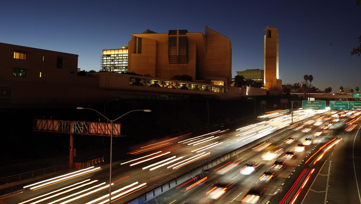 A judge ordered secret files held by Catholic orders concerning priests accused of molesting children to be released to the public. Above, traffic zips past the Cathedral of Our Lady of the Angels in downtown Los Angeles.