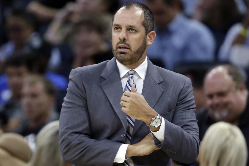 FILE - In this Oct. 24, 2017, file photo, Orlando Magic coach Frank Vogel watches his team play the Brooklyn Nets during the first half of an NBA basketball game in Orlando, Fla. A person familiar with the search says the Los Angeles Lakers have hired Vogel as coach. The person spoke to The Associated Press on condition of anonymity Saturday, May 11, because the hiring has not been announced. Vogel flew to Los Angeles on Thursday. The 45-year old Vogel did not coach last season following two years with the Magic. (AP Photo/John Raoux, File)