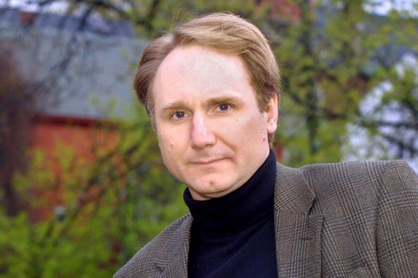 ** EDS NOTE: RETRANSMISSION TO REMOVE HOMETOWN FROM CAPTION ** ** ADVANCE FOR WEEKEND EDITIONS, JUNE 12-15 ** Author Dan Brown poses in Exeter, N.H., May 13, 2003 prior to a reading from his new book "The Da Vinci Code." The volumn, Brown's fourth novel, is a mixture of code-breaking, art history, secret societies, religion and lore, all wrapped up in a fast-paced thriller. (AP photo/Tim Boyd) ORG XMIT: NY304