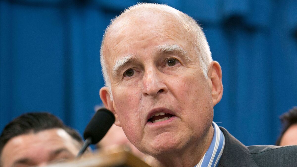 California Gov. Jerry Brown discusses the passage of a pair of climate change measures at a news conference in Sacramento in this July 17 file photo.