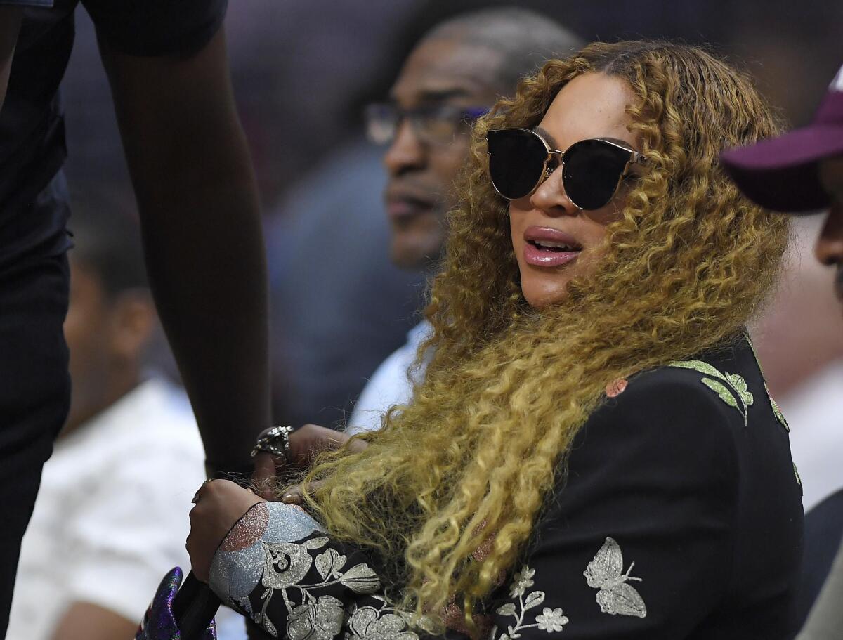 Seen at a Clippers playoff game in April. Beyoncé hasn't let her pregnancy slow her down.