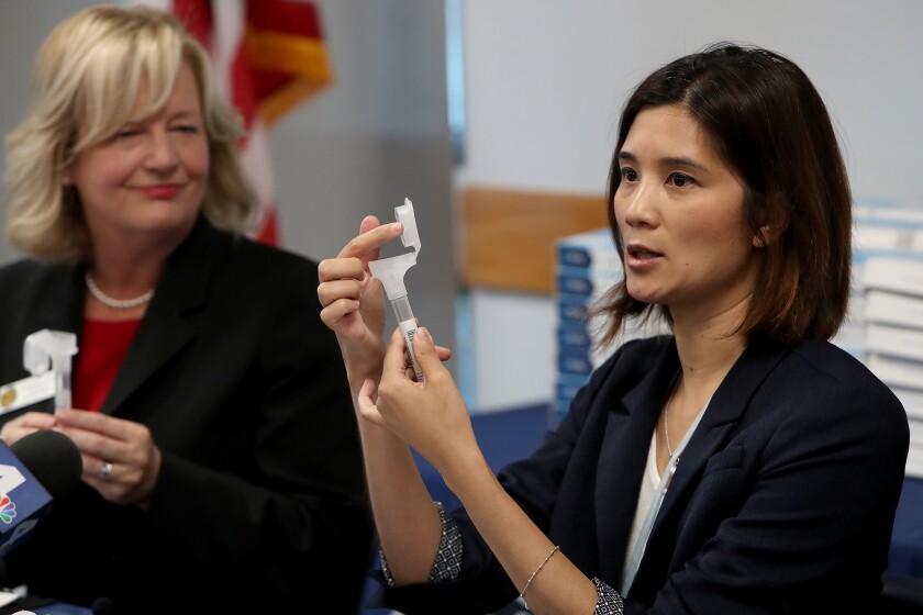 Dr. Regina Chinsio-Kwong and Orange County Supervisor Katrina Foley during a COVID-19 update.