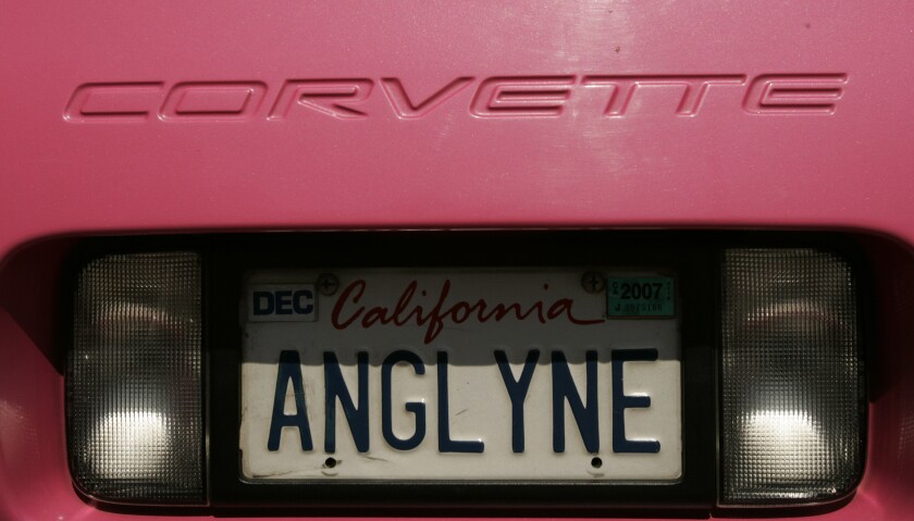 The back of a pink Corvette with a California license plate reading ANGLYNE.