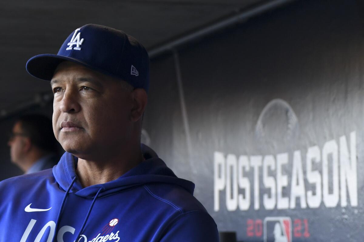 Dodgers manager Dave Roberts looks on from the dugout before Game 5 of the NLDS against the San Francisco Giants on Oct. 14.
