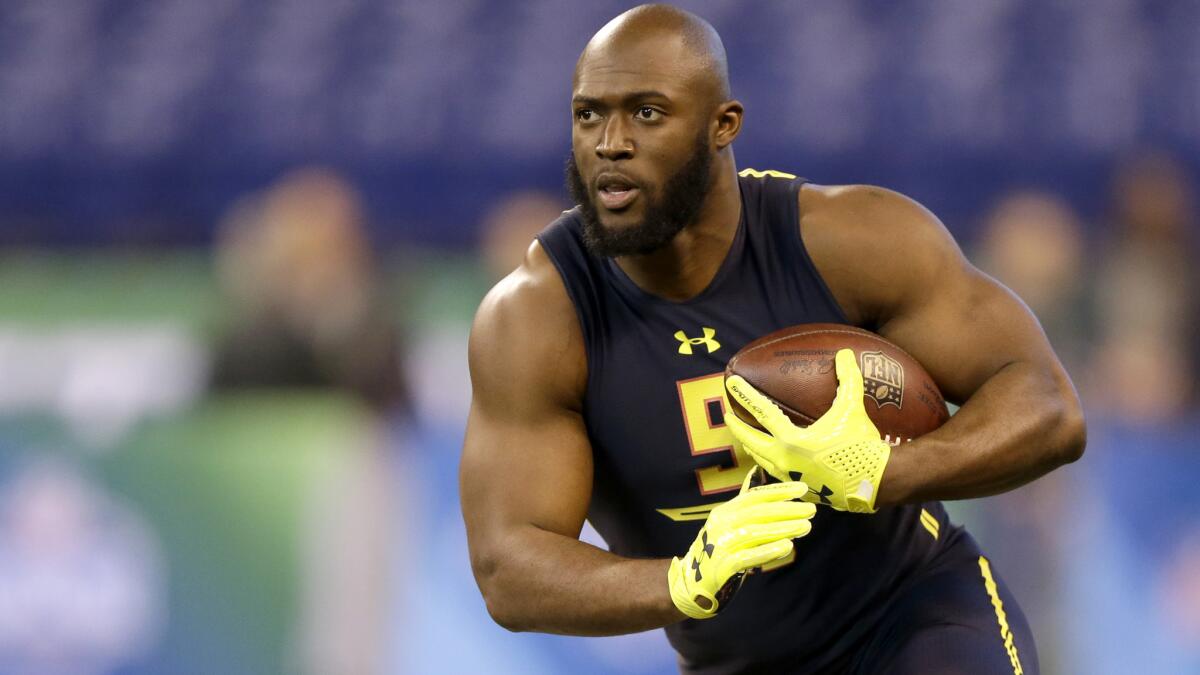 Former Louisiana State running back Leonard Fournette participates in a drill at the NFL scouting combine on Friday.