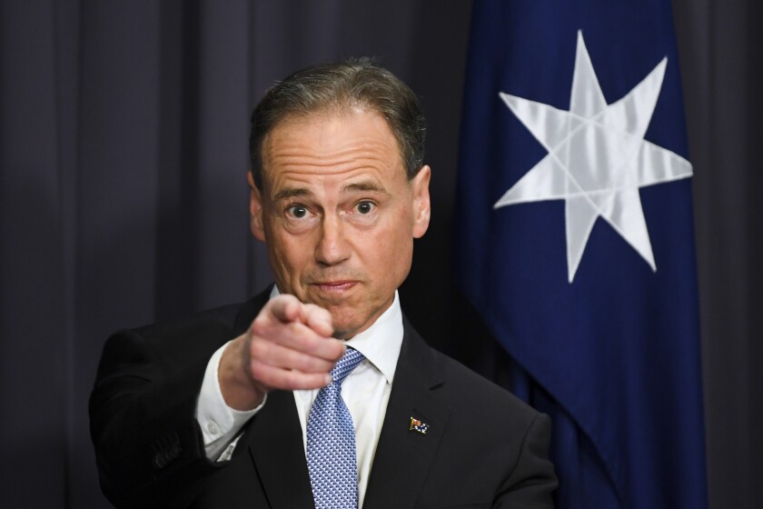 Australia's Health Minister Greg Hunt speaks to the media during a press conference at Parliament House in Canberra, Thursday, May 13, 2021. Australia has reached a supply agreement for 25 million doses of Moderna COVID-19 vaccines. (Lukas Coch/AAP Image via AP)