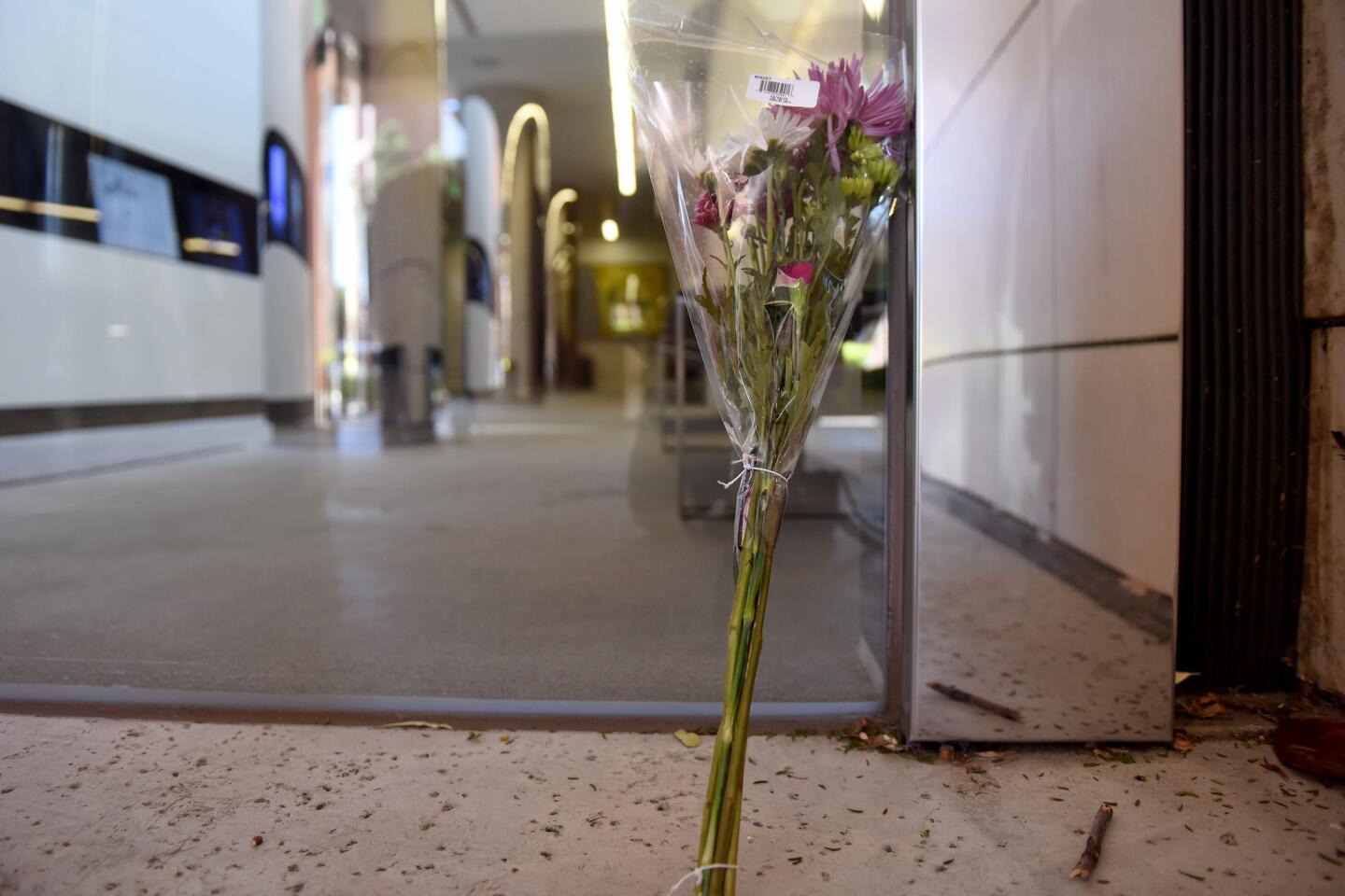 Flowers are placed outside the Seeley G. Mudd building on the USC campus where USC psychology professor Bosco Tjan was stabbed to death.