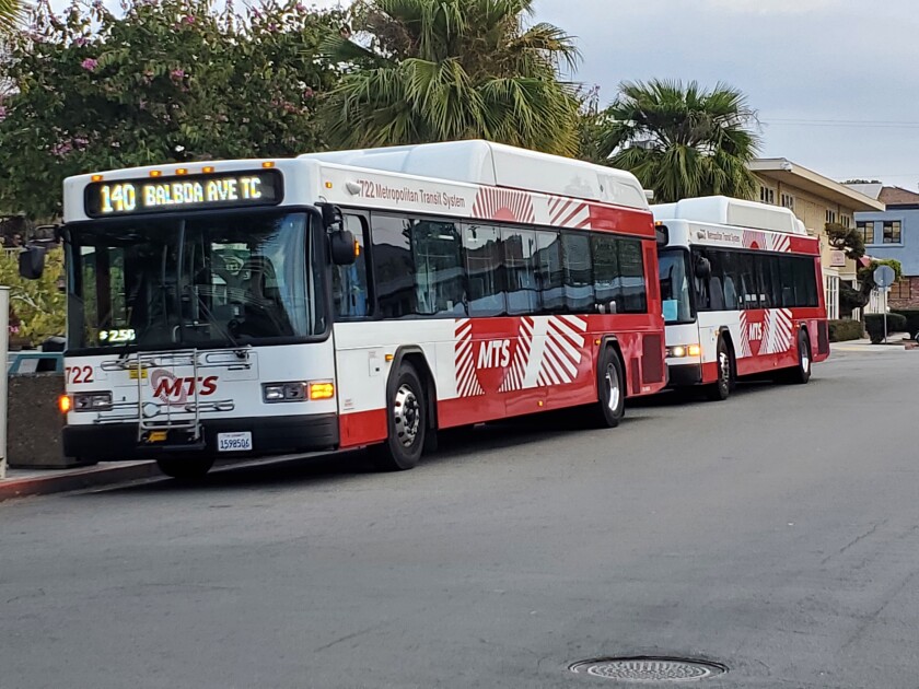 Two MTS Route 140 buses sit on Silverado Street in La Jolla.