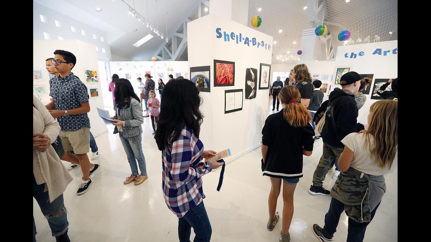 A busy gallery of artists and family at the Shell-A-Brate the Arts! youth art expo 2018 at the Betsy Lueke Creative Arts Center in Burbank on Thursday, April 5, 2018. The grade range for the artists who submitted 1,370 entries was from transitional kindergarten to high school seniors for all schools in Burbank.