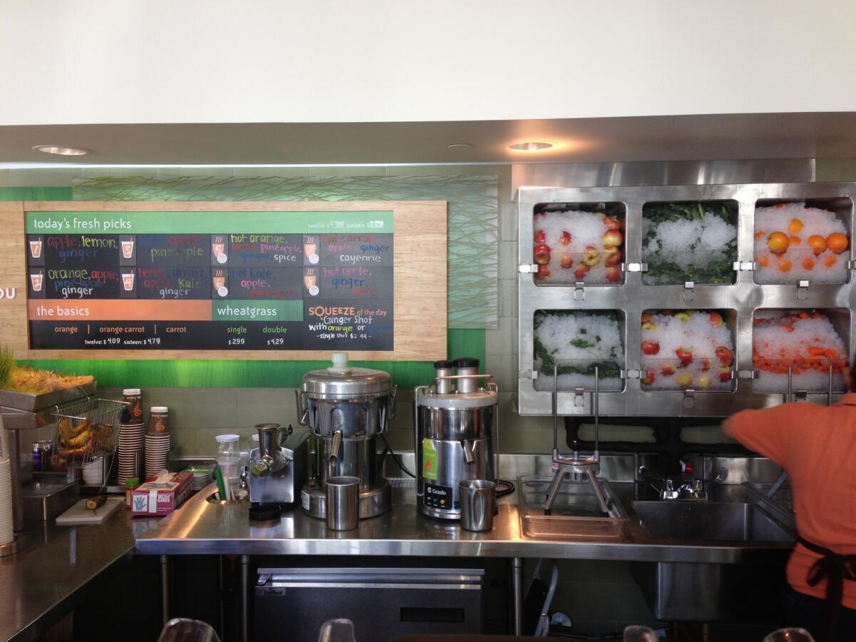 Jamba Juice's new store prototype highlights fresh-pressed juices made with ingredients such as kale and beets.