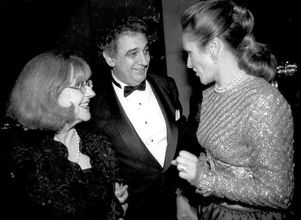 In 1993, Marta Domingo, left, who staged "Rigoletto" at the Dorothy Chandler Pavillion's Grand Hall, and husband Placido Domingo, who conducted, talk with Tara Colburn, who chaired the opening benefit.