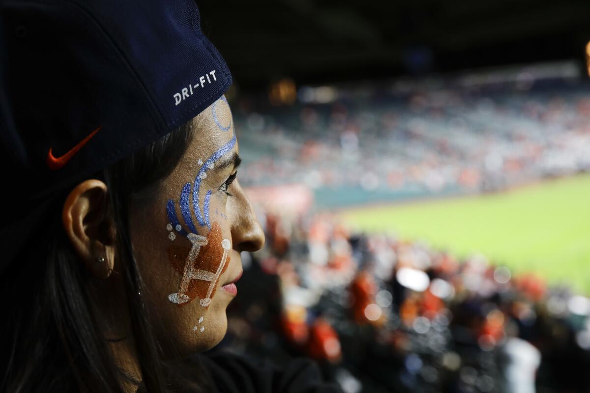 A fan watches batting practice before Game 3 of the 2017 World Series.