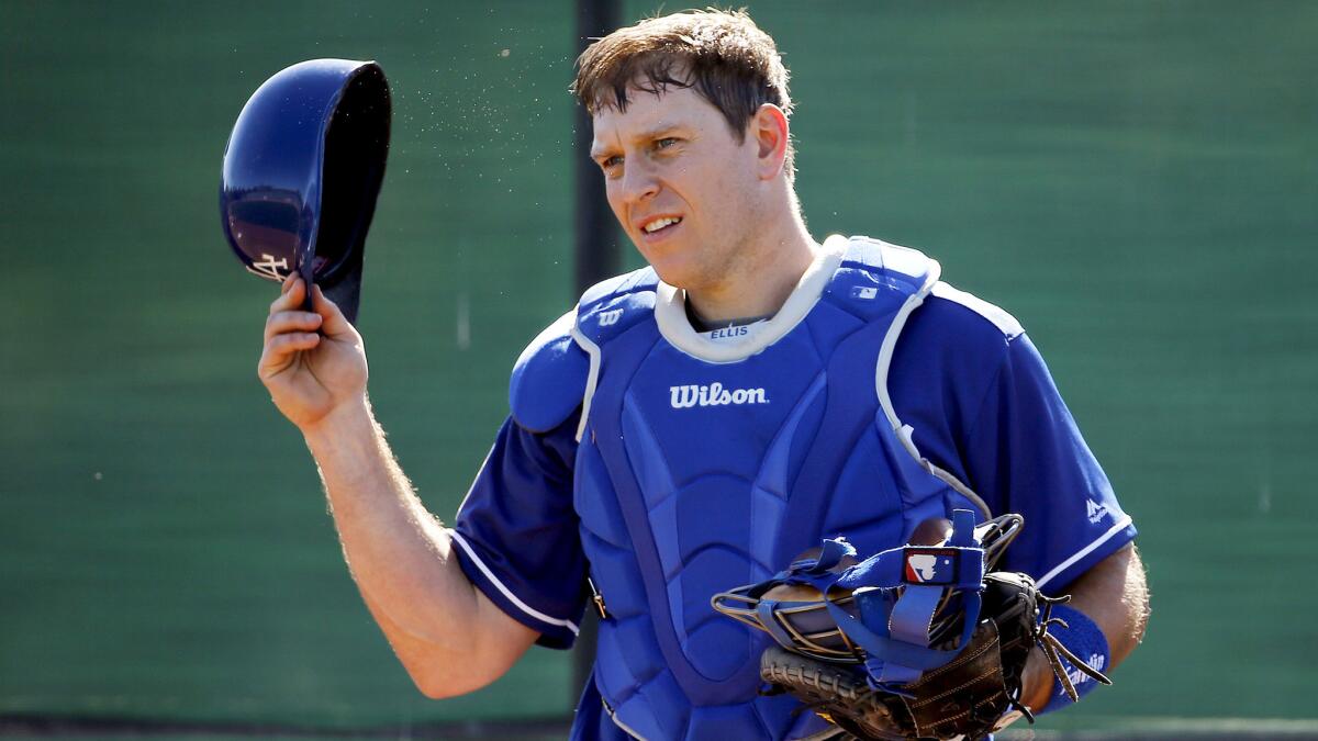 Dodgers catcher A.J. Ellis, shown during a spring training workout, had a two-run double Saturday.