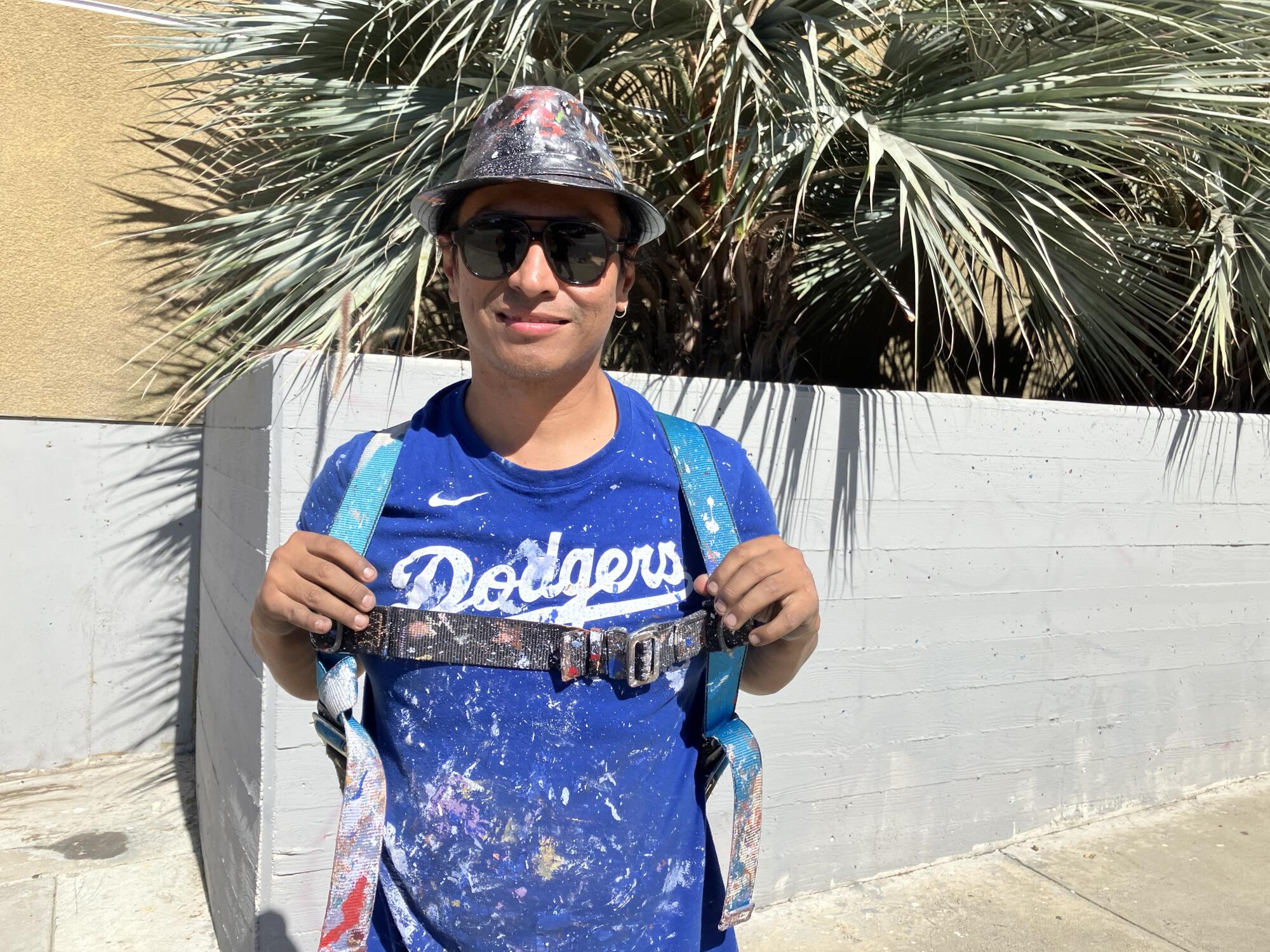 Robert Vargas started Fernando Valenzuela mural on the day the Dodgers nice died. It is change into an altar 1 Artist Robert Vargas stands in front of the Boyle Heights building where he is painting a mural honoring Fernando Valenzuela.