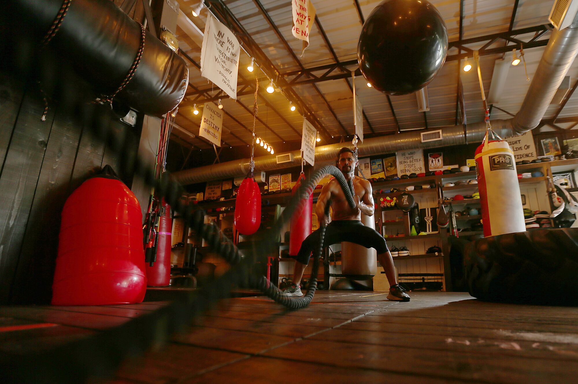 Joel Relampagos works out with ropes.