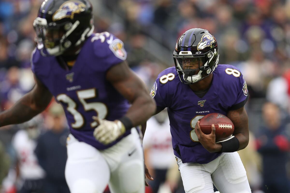 Ravens quarterback Lamar Jackson runs against the Texans during a game Nov. 17 at M&T Bank Stadium.