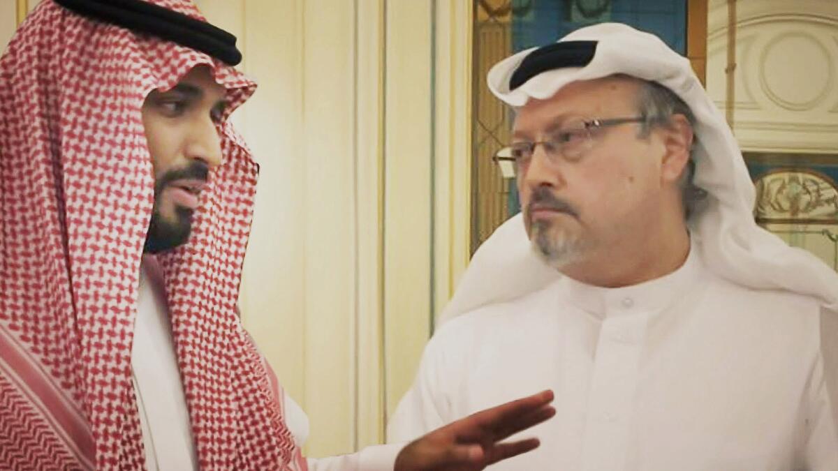 This image released by Briarcliff Entertainment shows Saudi Crown Prince Mohammed bin Salman, left, with journalist Jamal Khashoggi in a scene from the documentary "The Dissident." (Briarcliff Entertainment via AP)