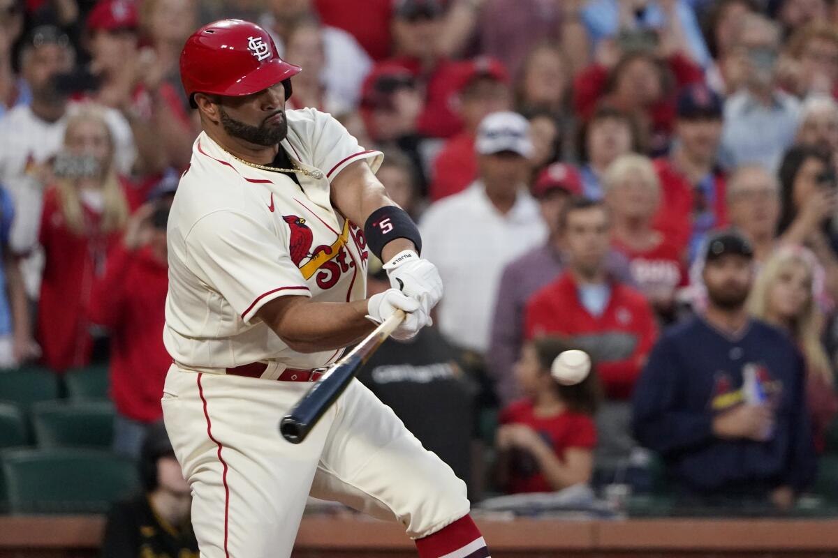 St. Louis Cardinals' Albert Pujols hits a two-run single during the first inning of a baseball game against the Pittsburgh Pirates Saturday, Oct. 1, 2022, in St. Louis. (AP Photo/Jeff Roberson)