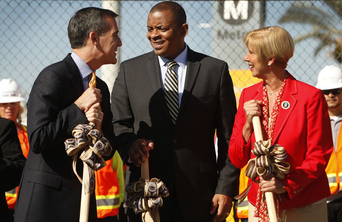 Los Angeles Mayor Eric Garcetti, U.S. Secretary of Transportation Anthony Fox and Rep. Janice Hahn (D-San Pedro), left to right, at the groundbreaking for the Downtown Regional Connector rail project in September. Foxx came to Los Angeles Thursday to urge Congress to approve more funding for highway and rail projects.