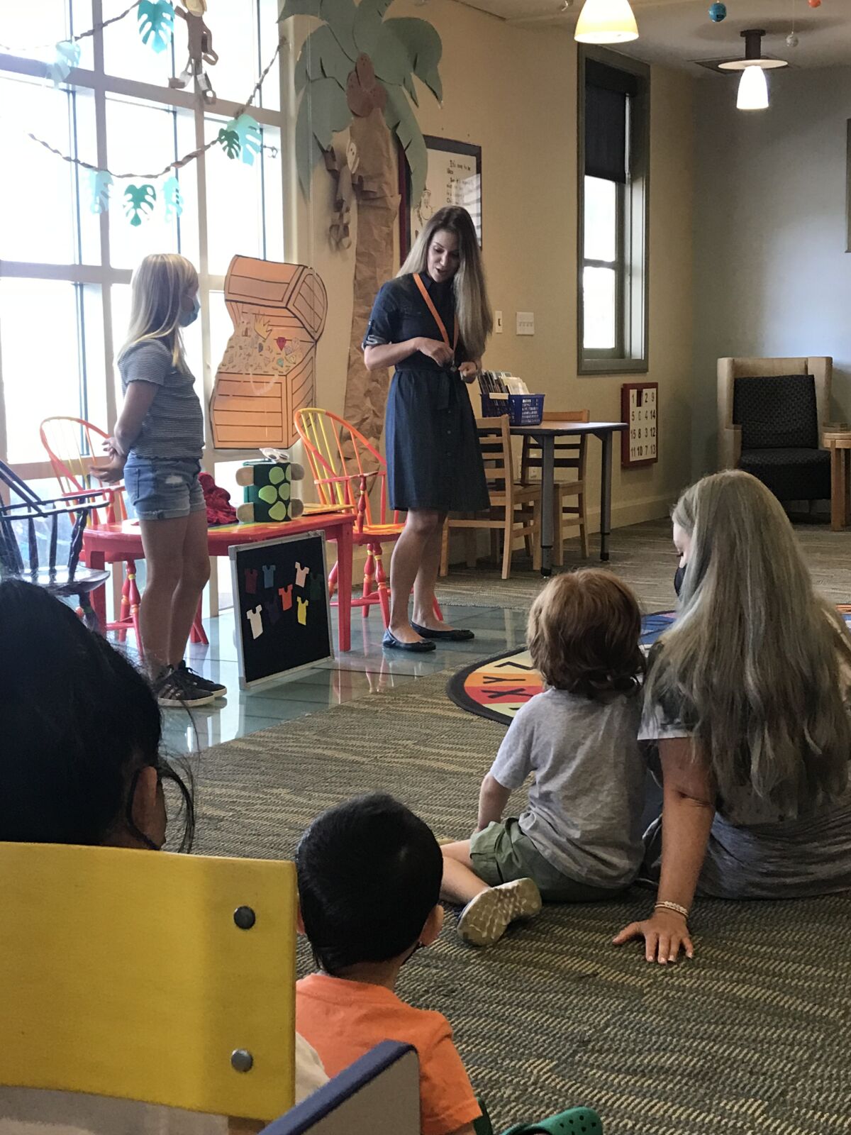 Alexis Crane (left) traveled from Coronado to visit new La Jolla youth services librarian Katia Graham.
