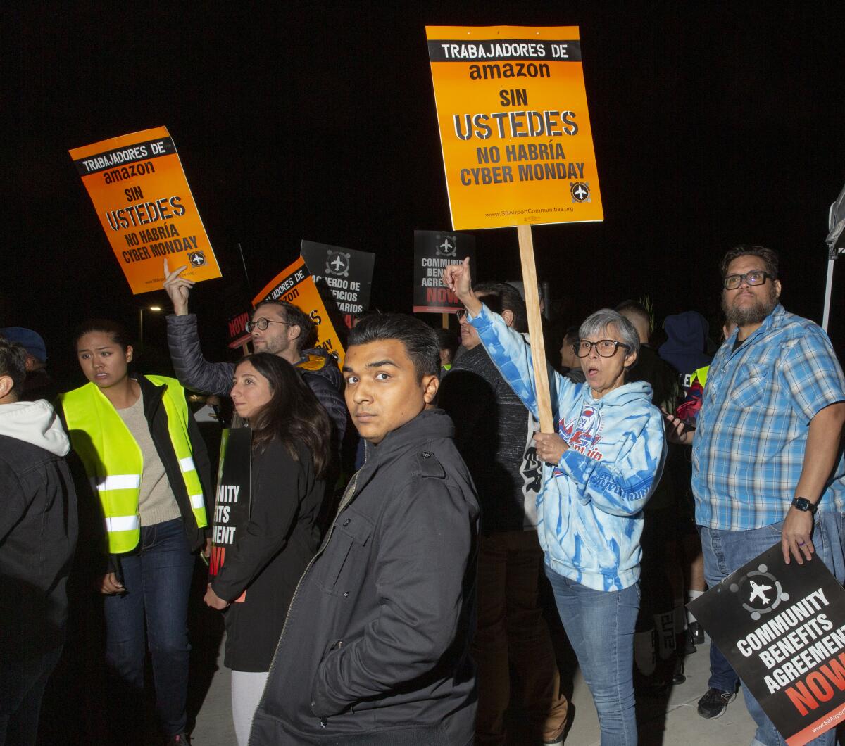 Protesters outside the Amazon facility in San Bernardino called on the company to improve working conditions and salary for its employees.