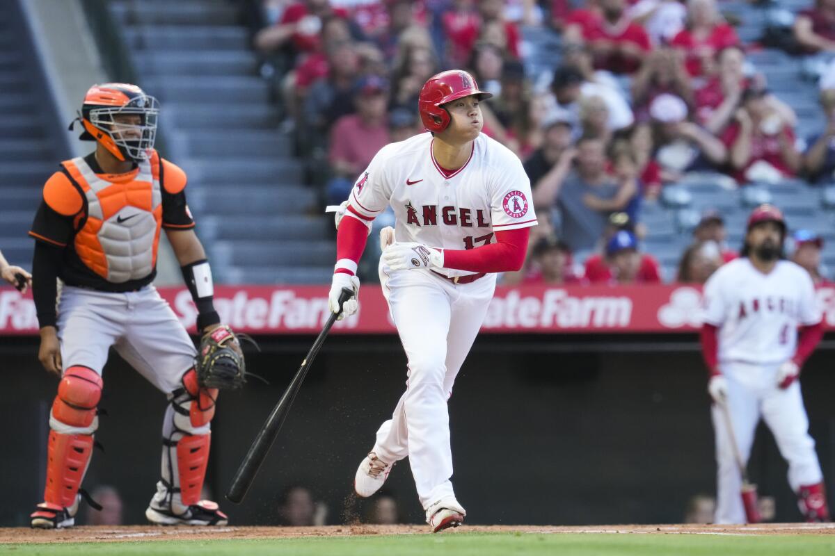 Angels designated hitter Shohei Ohtani runs to first base while flying out.