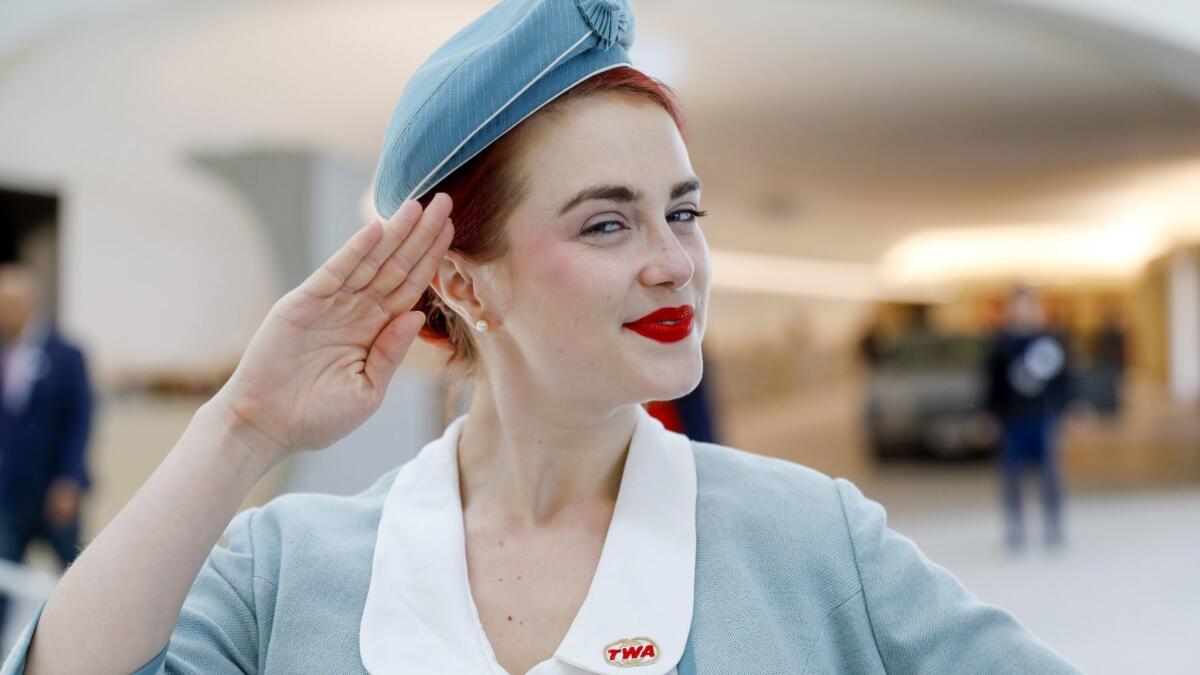 Pearls Daily, an entertainer on hand for the opening, wears a vintage TWA stewardess uniform as she greets visitors to the TWA Hotel.