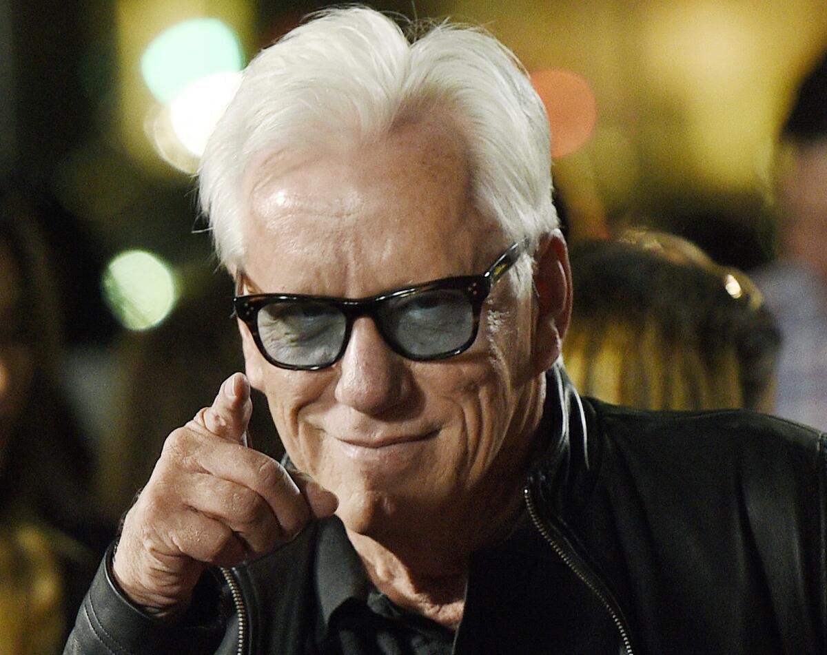 The Twitter account of actor James Woods has been suspended over a controversial tweet that Woods refuses to delete.