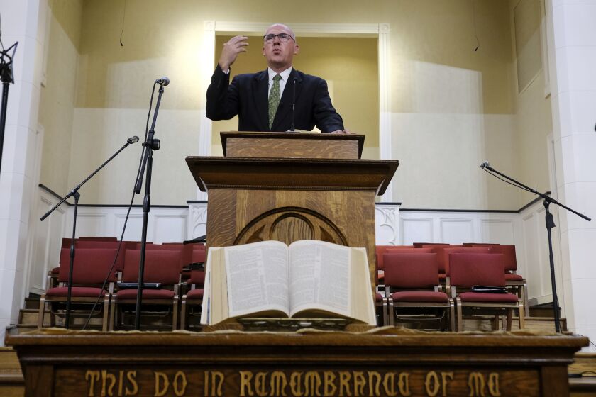 Pastor Bart Barber, president of the Southern Baptist Convention, preaches from the pulpit of the First Baptist Church of Farmersville, Texas, on Sunday, Sept. 25, 2022. For nearly a quarter-century, Barber enjoyed relative obscurity as a pastor in this town of 3,600, about 50 miles northeast of Dallas. That changed in June as delegates to the Southern Baptist Convention’s annual meeting in California, chose Barber to lead the nation’s largest Protestant denomination at a time of major crisis. (AP Photo/Audrey Jackson)