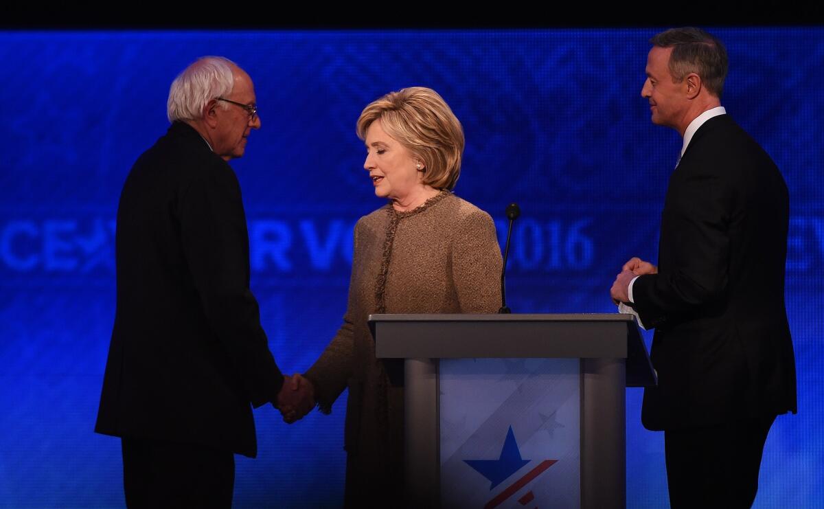 Democratic presidential hopefuls Bernie Sanders, Hillary Clinton and Martin O'Malley, from left, greet one another after their New Hampshire debate.