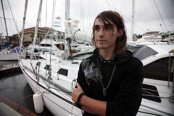 Zac Sunderland with his sailboat, Intrepid, in rainy Puerto Vallarta, Mexico. Sunderland, now 17, embarked from Marina del Rey on June 14, 2008, on a mission to become the youngest sailor ever to circumnavigate the globe alone.