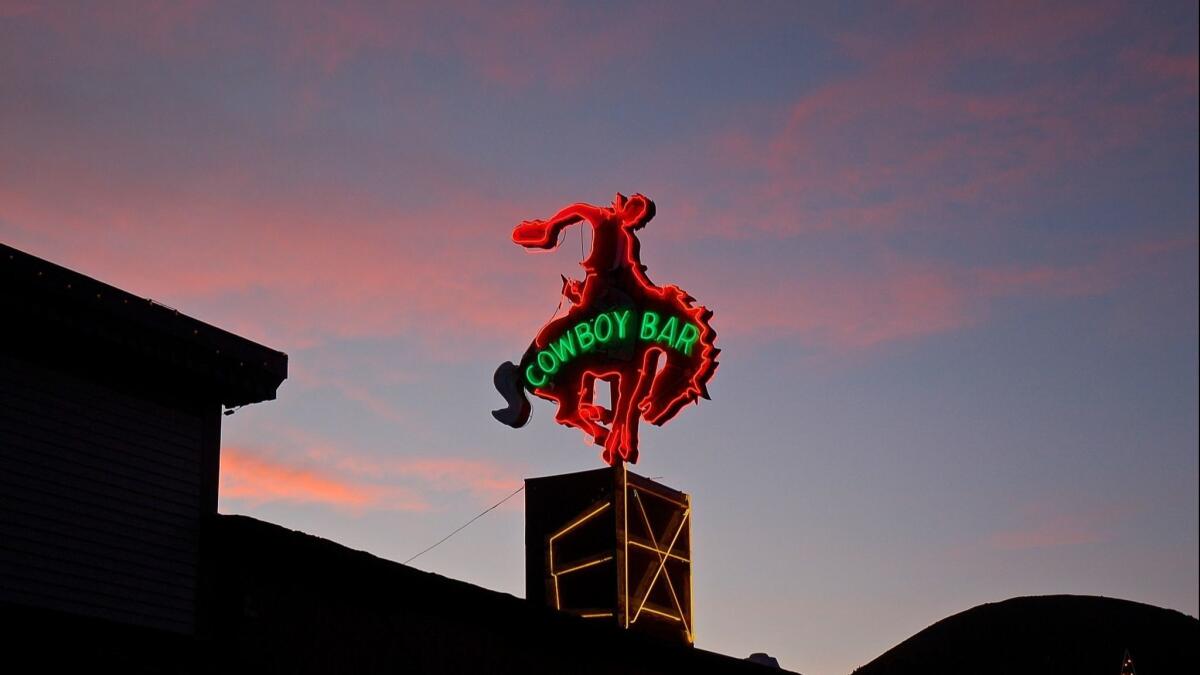 If that cowboy could see the cost of real estate here, he'd be gone. But he'd probably like the town square's arches — they're made of elk antlers.