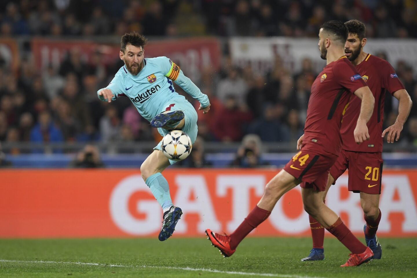 FC Barcelona's Argentinian forward Lionel Messi kicks the ball during the UEFA Champions League quarter-final second leg football match between AS Roma and FC Barcelona at the Olympic Stadium in Rome on April 10, 2018.