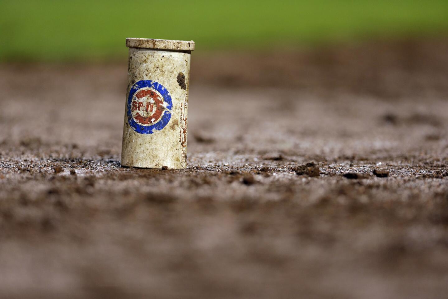 A weight used in the on-deck circle by the Cubs is seen during the game.