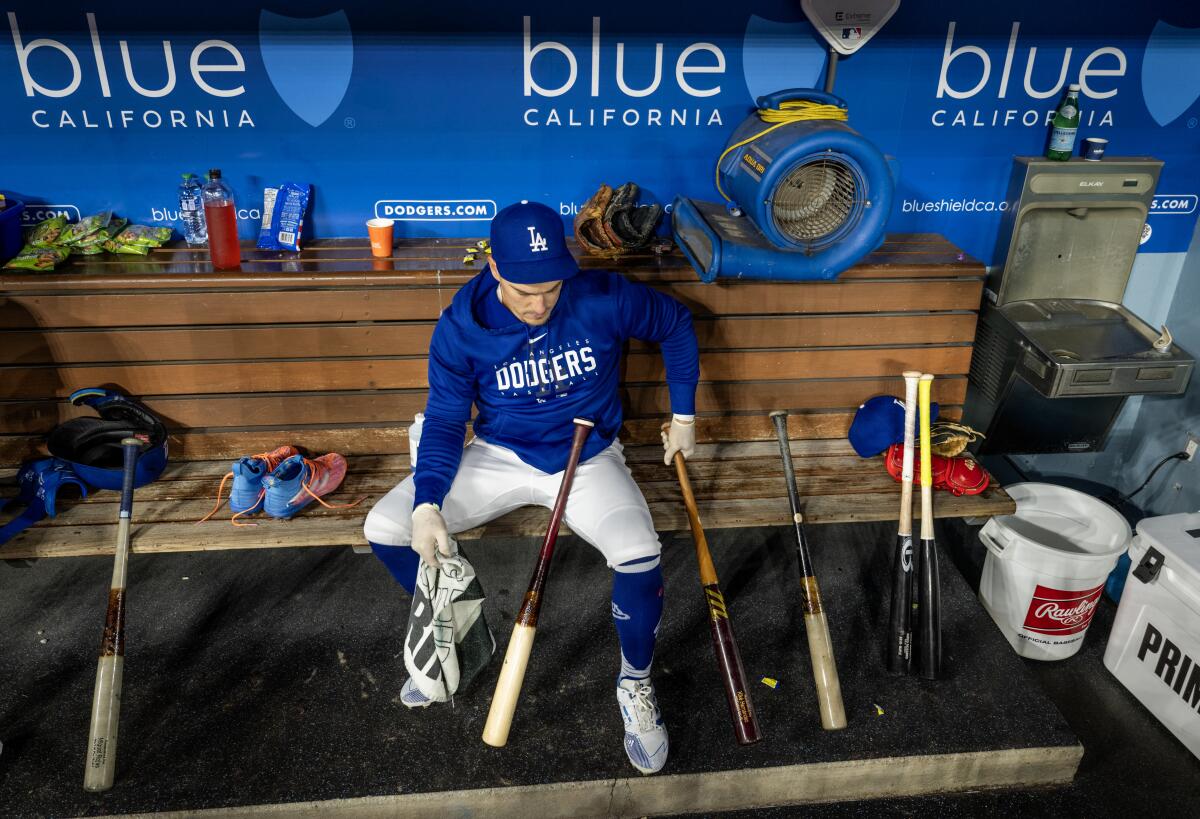Kiké Hernández sits in the dugout before a game against the Giants in September.