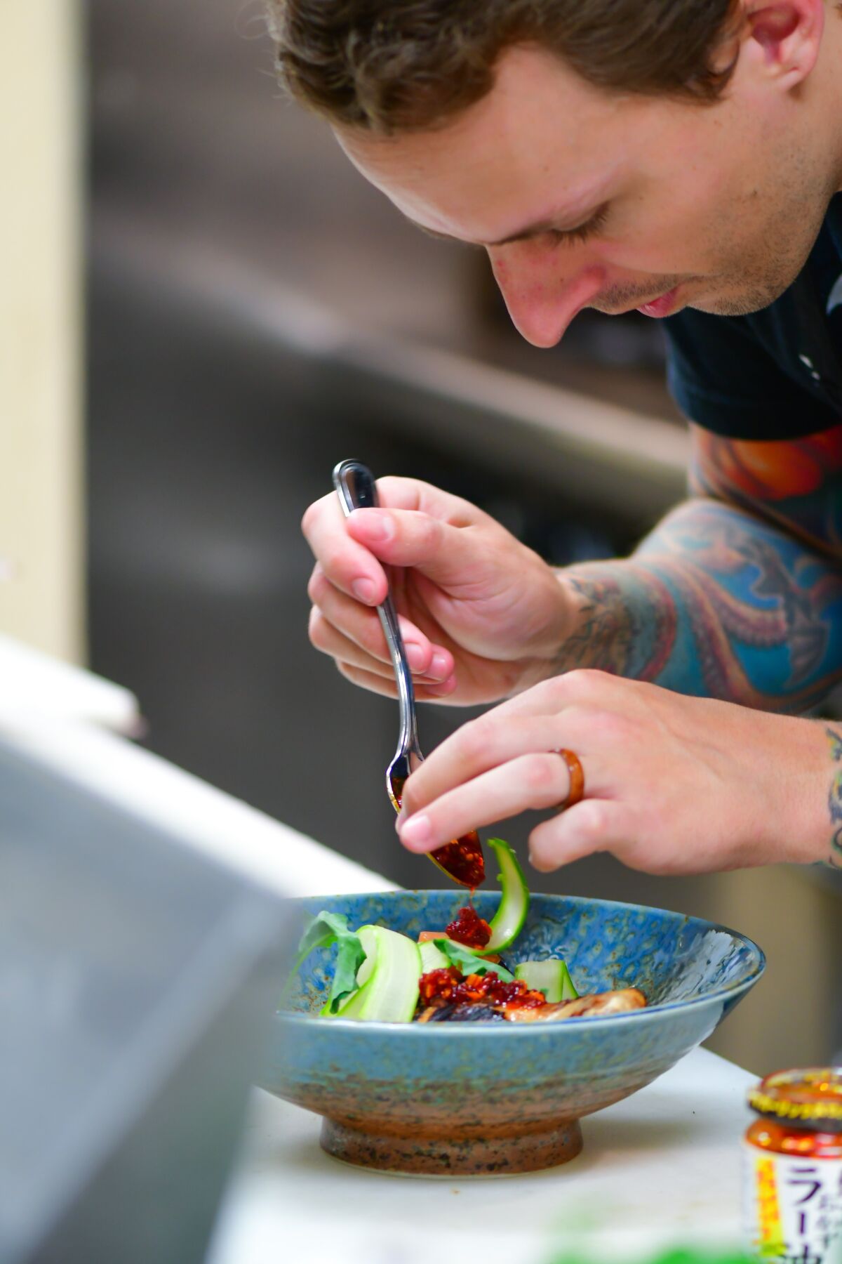 Chef William Eick plates a dish for his now-in-development Japanese-inspired restaurant Matsu, which he's fine-tuning by serving a Matsu tasting menu dinner for just one table three nights a week at Mission Ave Bar and Grill in Oceanside, where he serves as executive chef.
