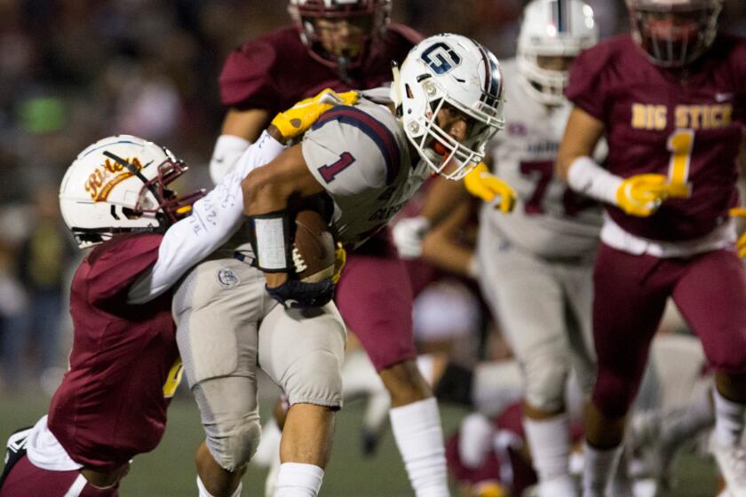 EAST LOS ANGELES, CA - Friday, Nov. 1 Garfield High School Bull Dogs Running Back P.J Garcia.