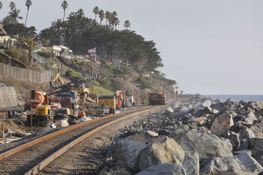 San Clemente, CA - November 28: South of San Clemente State Beach railroad and bluff repairs occur below the Cypress Cove development at upper left. (Charlie Neuman / For The San Diego Union-Tribune)