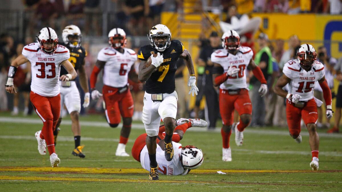 Arizona State's Kalen Ballage runs for his eighth touchdown of the night against Texas Tech.