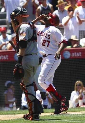 Los Angeles Angels' Vladimir Guerrero points to the sky after