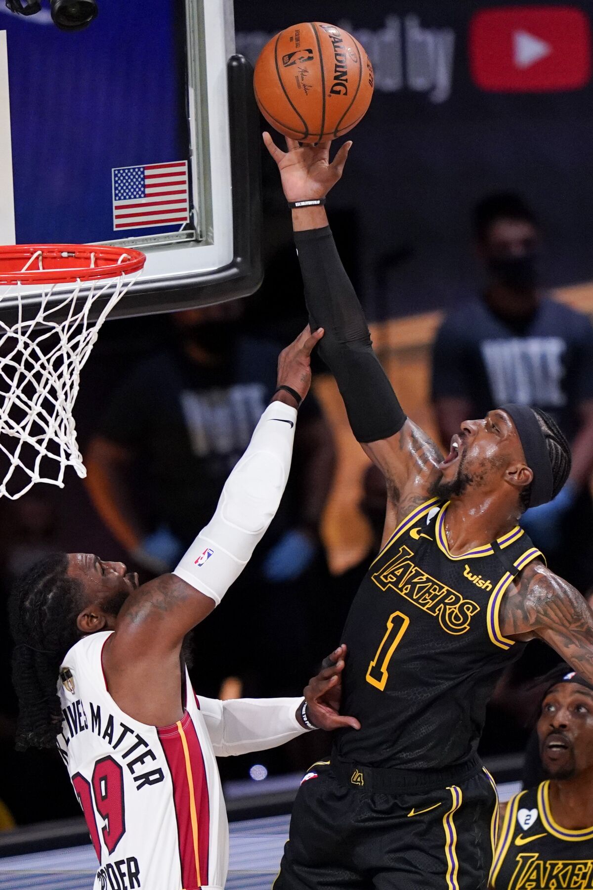 Lakers guard Kentavious Caldwell-Pope scores on a layup and draws a foul against Heat forward Jae Crowder during Game 5.