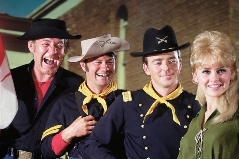 UNITED STATES - SEPTEMBER 14: F TROOP - gallery - Season One - 9/14/65, Ken Berry (right) played Captain Wilton Parmenter, the commanding officer at Fort Courage, a fictional Army outpost in Kansas, in this series set in 1865. Parmenter's subordinates at Fort Courage included Sgt. Morgan O'Rourke (Forrest Tucker, left) and Corporal Randolph Agarn (Larry Storch), O'Rourke's dimwitted sidekick and business partner in the illegal O'Rourke Enterprises. Wrangler Jane Angelica Thrift (Melody Patterson), the general store owner, set her sights on marrying the naive Parmenter., (Photo by ABC Photo Archives/ABC via Getty Images) ** OUTS - ELSENT, FPG - OUTS * NM, PH, VA if sourced by CT, LA or MoD **
