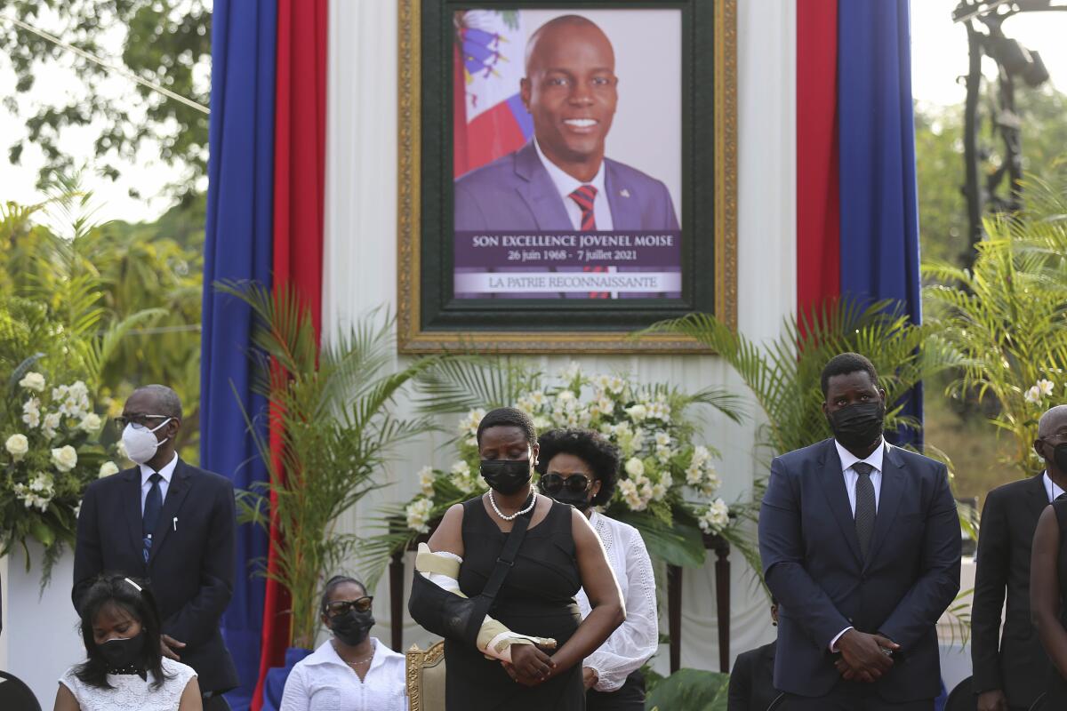 FILE - First Lady Martine Moise, center, attends a memorial service for her late husband President Jovenel Moise, at the National Pantheon Museum, in Port-au-Prince Haiti, July 21, 2021. Rodolphe Jaar, a businessman with dual Haitian and Chilean nationality pleaded not guilty Wednesday, July 6, 2022, to two criminal charges for the 2021 assassination of Moise. (AP Photo/Odelyn Joseph, File)